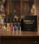 5ml glass perfume tester spray bottles displaying labels for Oud For Greatness, Stronger With You, Oud Rosewood, Oud Montaigne, and Black Opium on a wooden surface against a luxury background.